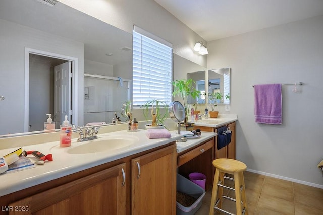 bathroom featuring a shower stall, baseboards, tile patterned flooring, and vanity