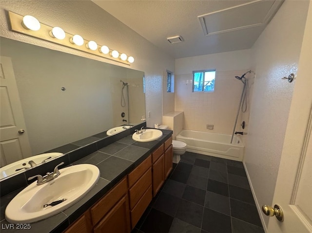 full bath featuring double vanity, a textured ceiling, bathtub / shower combination, and a sink