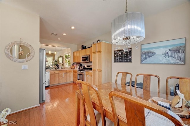 dining area featuring light wood-style flooring, visible vents, a notable chandelier, and recessed lighting