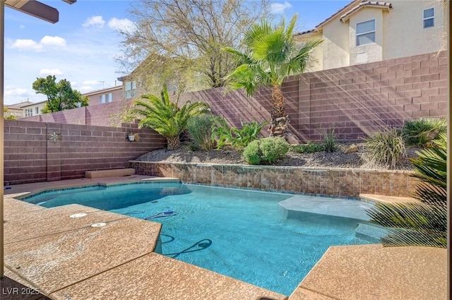 view of swimming pool featuring a fenced backyard and a fenced in pool