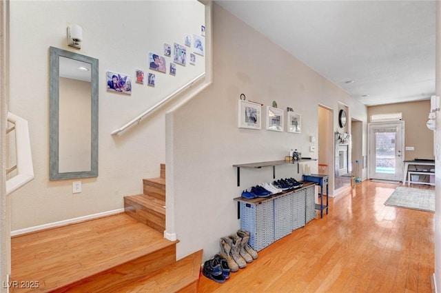 interior space with wood finished floors and baseboards