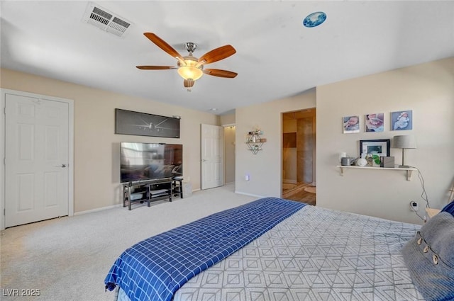 bedroom featuring baseboards, visible vents, a ceiling fan, and light colored carpet