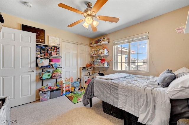 bedroom with carpet floors, a closet, and a ceiling fan