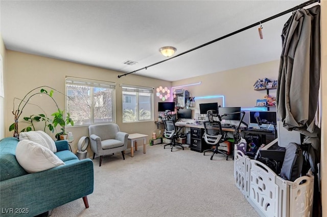 office with visible vents and light colored carpet