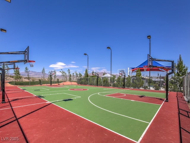 view of sport court with community basketball court and fence