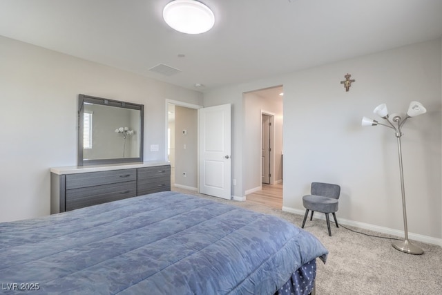 bedroom featuring carpet and baseboards