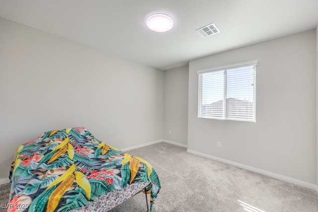 bedroom with baseboards, visible vents, and carpet flooring