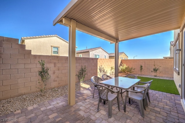 view of patio / terrace featuring outdoor dining area and a fenced backyard