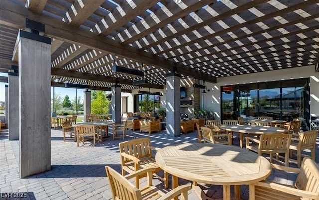 view of patio featuring outdoor dining area and a pergola