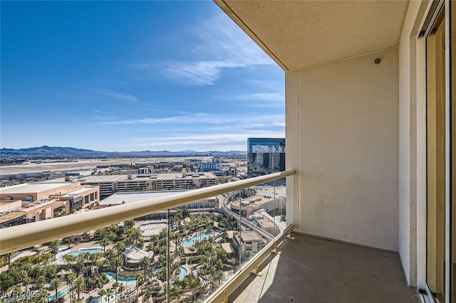 balcony with a view of city and a mountain view