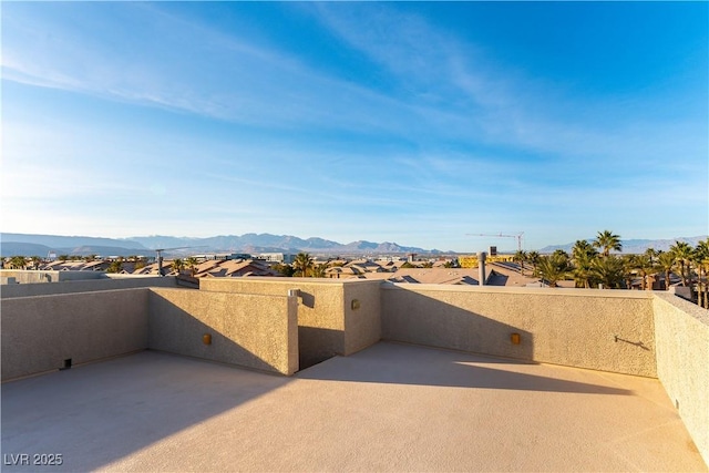 view of patio / terrace with a balcony and a mountain view