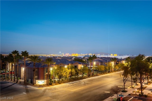 view of road featuring a residential view, curbs, and sidewalks