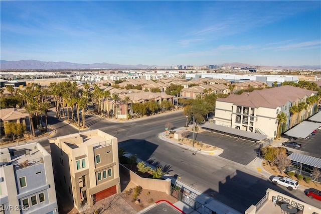 drone / aerial view featuring a residential view and a mountain view