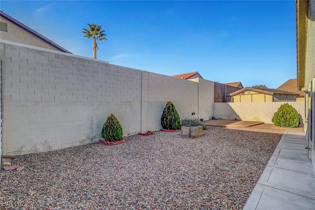 view of yard with a fenced backyard