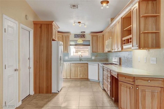 kitchen with white appliances, a sink, visible vents, light countertops, and open shelves