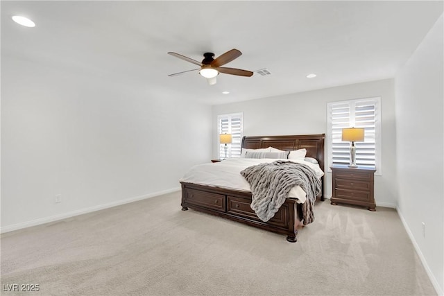 bedroom with baseboards, visible vents, light colored carpet, and recessed lighting