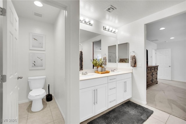 full bathroom with toilet, visible vents, and a sink