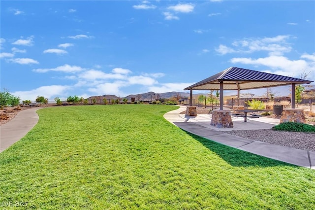 surrounding community with a yard, a patio, and a gazebo