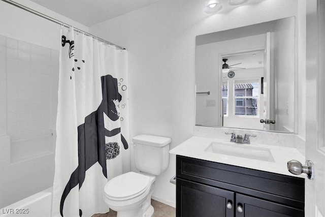 bathroom featuring a ceiling fan, vanity, toilet, and shower / bath combo with shower curtain