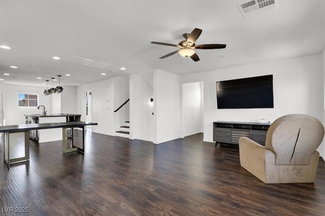 game room featuring dark wood-style flooring, recessed lighting, visible vents, a ceiling fan, and a sink