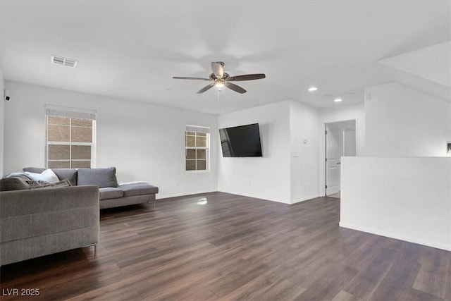 living area featuring a ceiling fan, visible vents, dark wood-style flooring, and recessed lighting