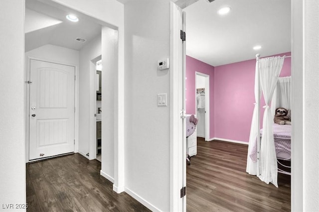 hallway featuring recessed lighting, dark wood-style flooring, visible vents, and baseboards