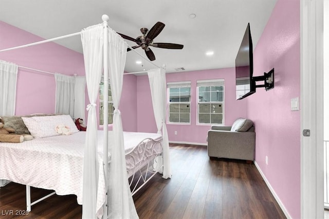 bedroom featuring recessed lighting, dark wood finished floors, and baseboards