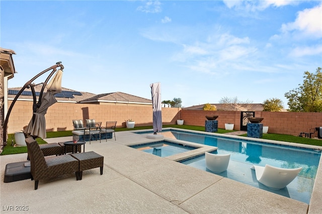 view of pool with a fenced in pool, an in ground hot tub, a fenced backyard, and a patio