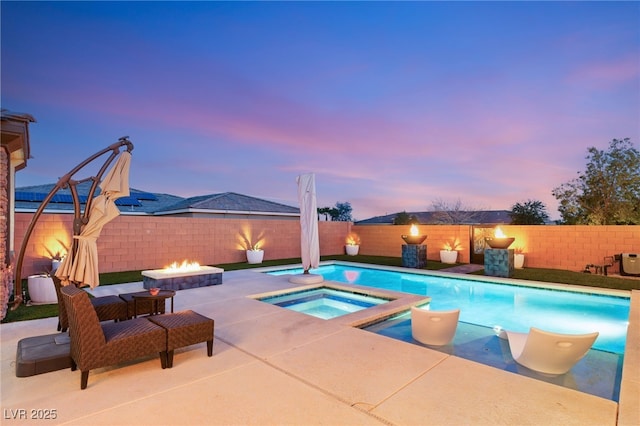 view of pool featuring a patio, a fenced in pool, an outdoor fire pit, an in ground hot tub, and a fenced backyard