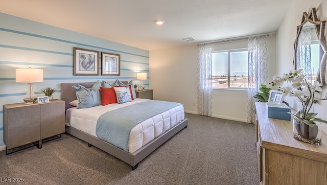 bedroom featuring carpet and baseboards