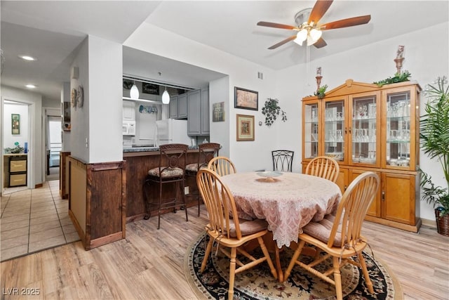 dining space featuring light wood-style floors, recessed lighting, and a ceiling fan