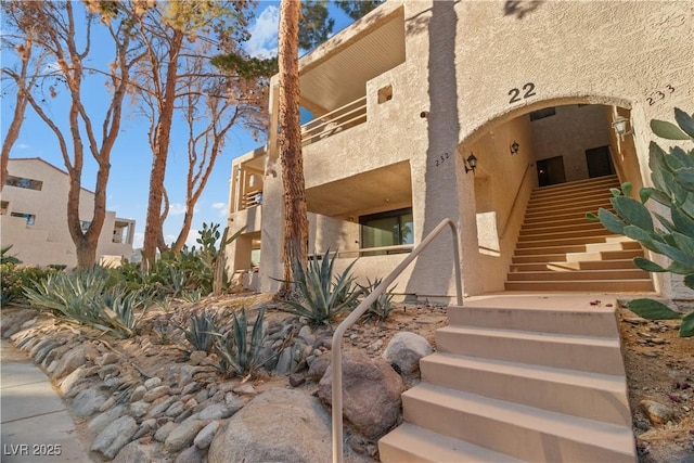 view of property featuring stairs