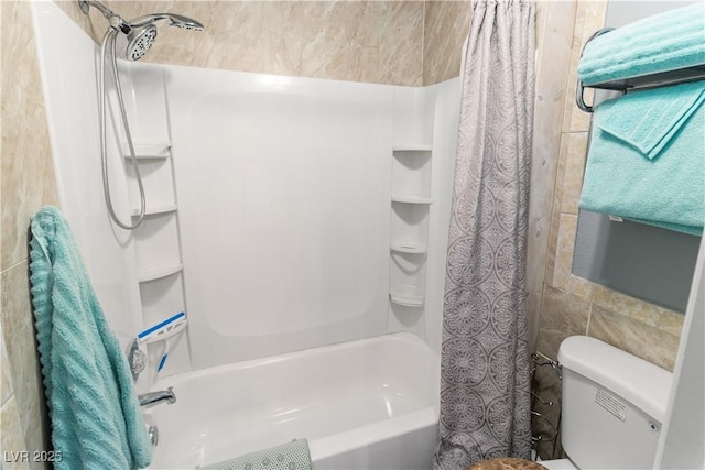 bathroom with toilet, tile walls, and shower / bath combination with curtain