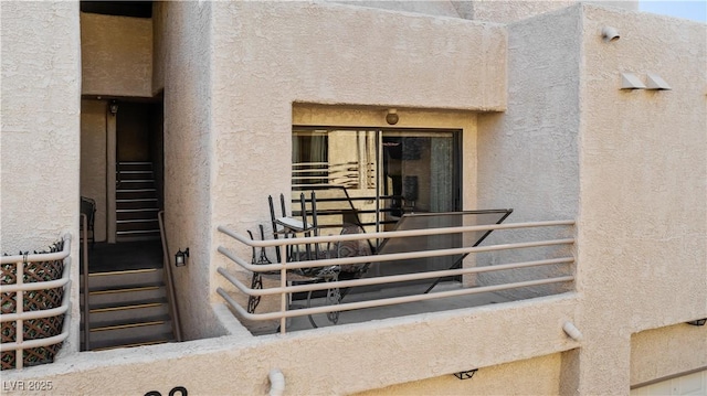 doorway to property with stucco siding