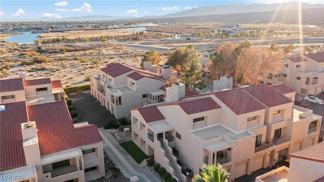 birds eye view of property with a residential view and a mountain view