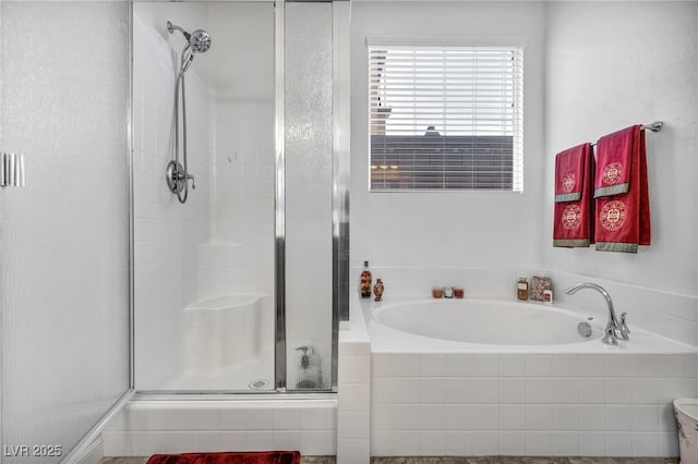 full bath with a garden tub and a shower stall