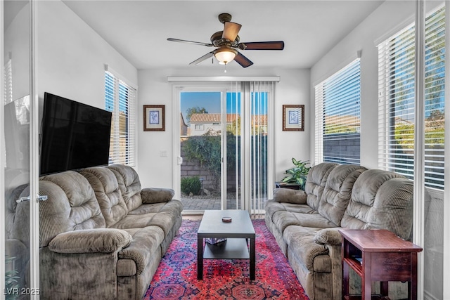 living area with ceiling fan