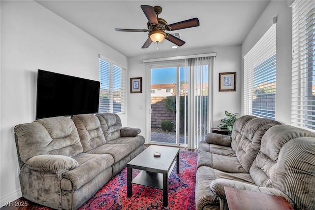 living room featuring ceiling fan and wood finished floors