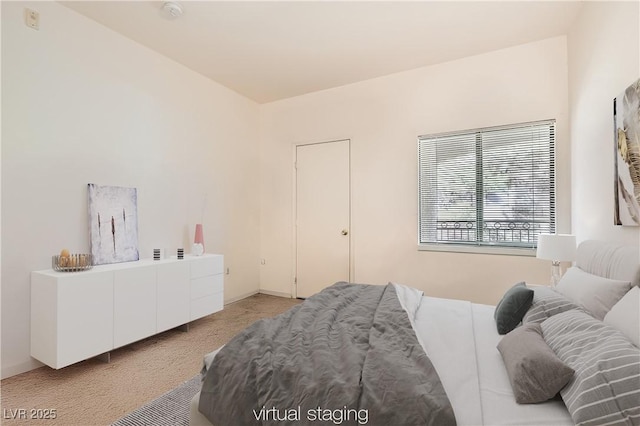 bedroom with light colored carpet