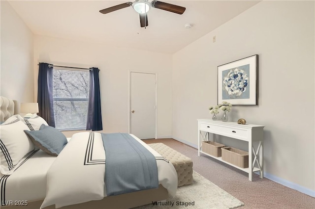 bedroom with a ceiling fan, light colored carpet, and baseboards