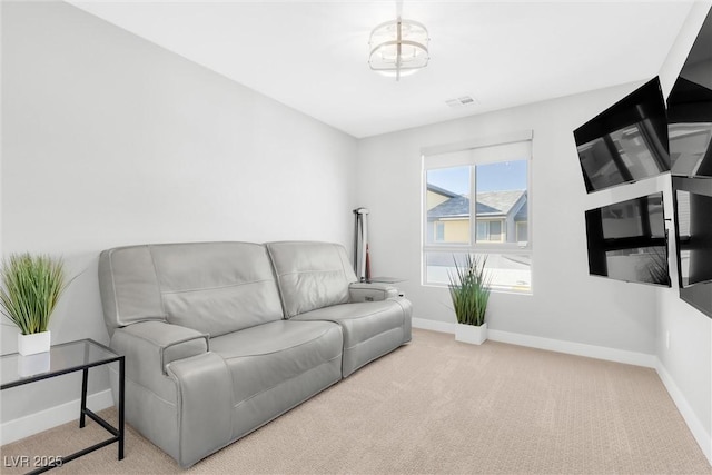 living room featuring light carpet, visible vents, and baseboards
