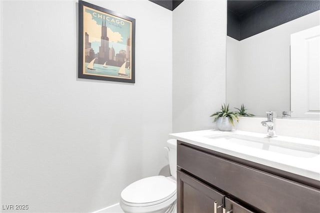 half bath with vanity and toilet