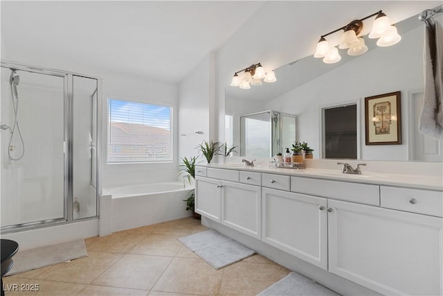 full bath with vaulted ceiling, double vanity, a stall shower, and tile patterned floors