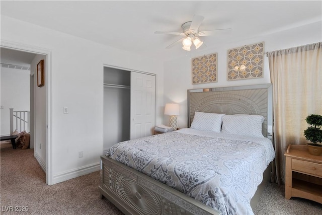 carpeted bedroom featuring a ceiling fan, baseboards, and a closet