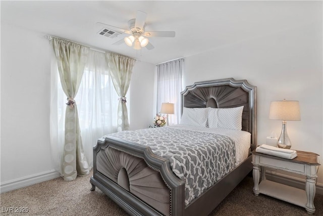 bedroom featuring ceiling fan, dark carpet, visible vents, and baseboards