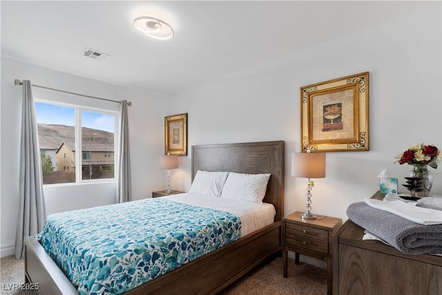 bedroom with carpet flooring and visible vents