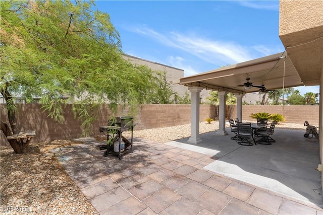 view of patio / terrace with ceiling fan, outdoor dining area, and a fenced backyard