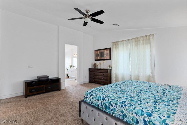 bedroom with lofted ceiling, ensuite bathroom, carpet flooring, visible vents, and a ceiling fan