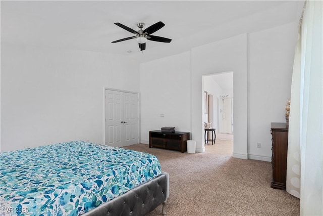 bedroom with a ceiling fan and carpet