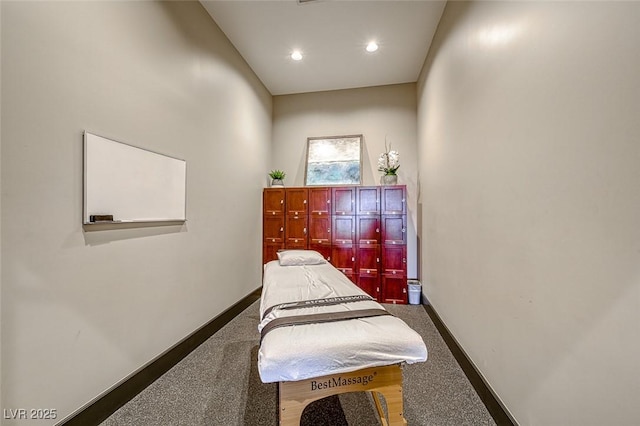 bedroom with recessed lighting, dark carpet, and baseboards